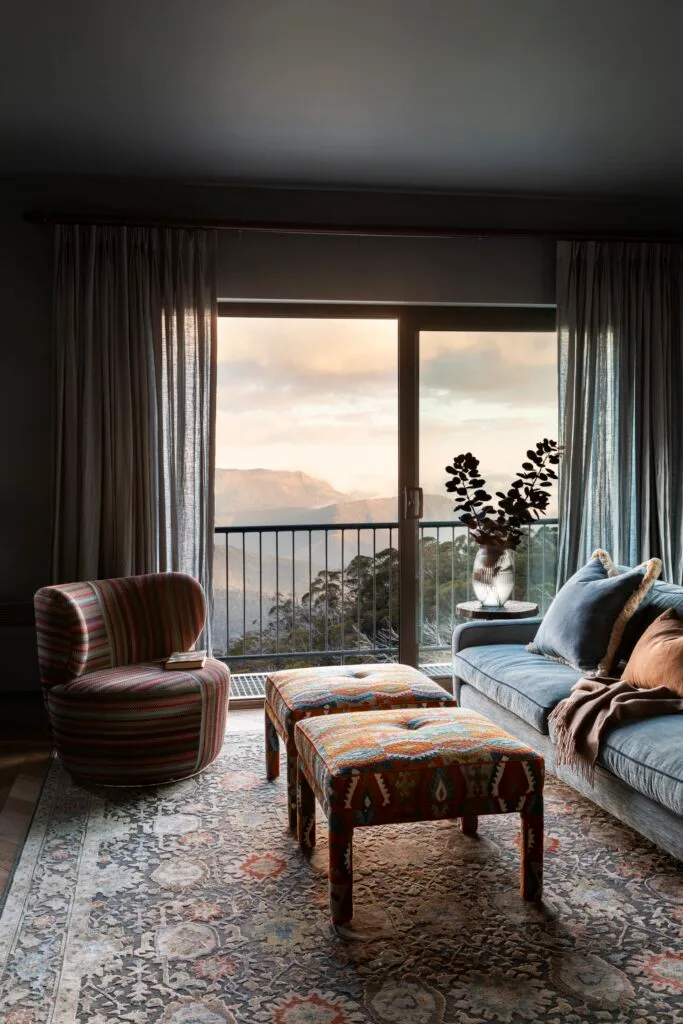 A dark living area overlooking the hills of Mount Buller.