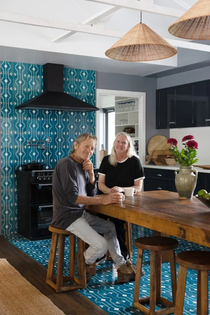 A portrait of owners Margaret and Peter in the kitchen.