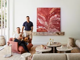 Darren Palmer with Olivier Duvillard and their dogs in the living room.