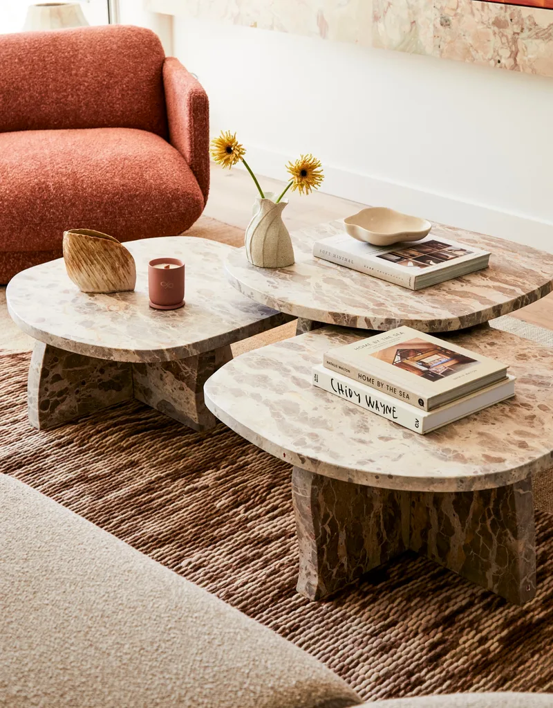 Darren Palmer's Bondi home living room with three nesting coffee tables.
