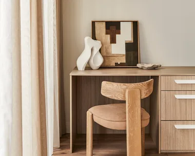 Darren Palmer home office with desk, chair and artwork.