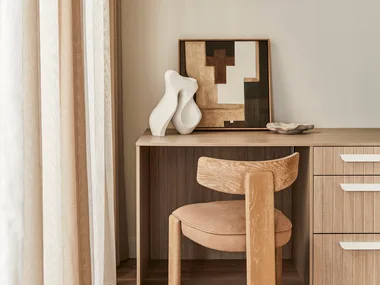 Darren Palmer home office with desk, chair and artwork.