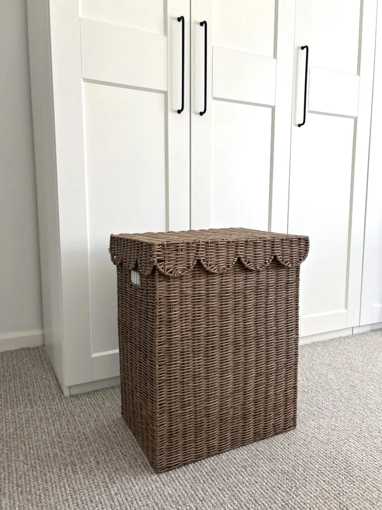 The Most Aesthetic Laundry Basket against white cupboard