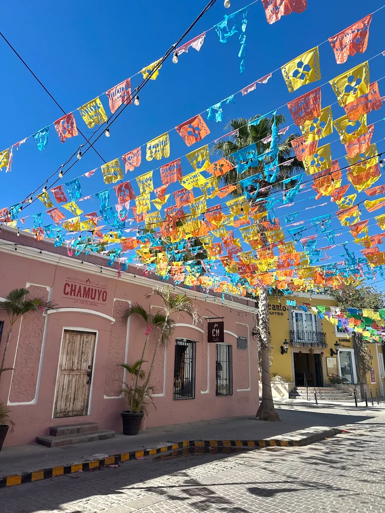 Bright buntings strung from buildings in Los Cabos.
