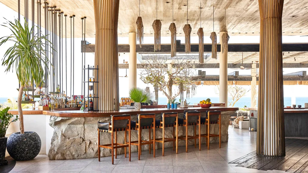 A tropical bar inside Chileno Bay Resort & Residences.