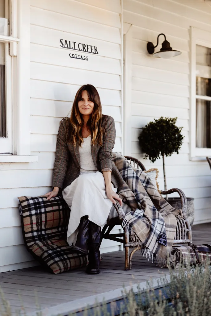 Amanda Cochran sitting on the verandah of her Salt Creek Cottage.
