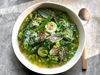Green minestrone soup with dumplings.
