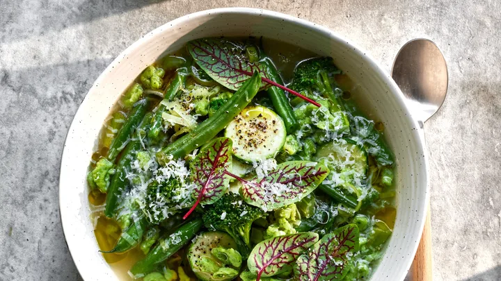 Green minestrone soup with dumplings.