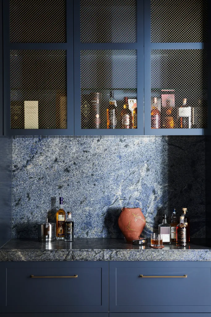 A moody blue bar cabinet.