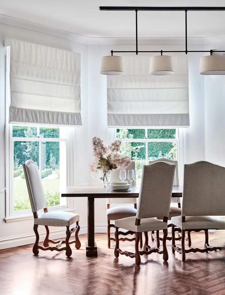 A classic country dining room with a vintage dining table and chairs.