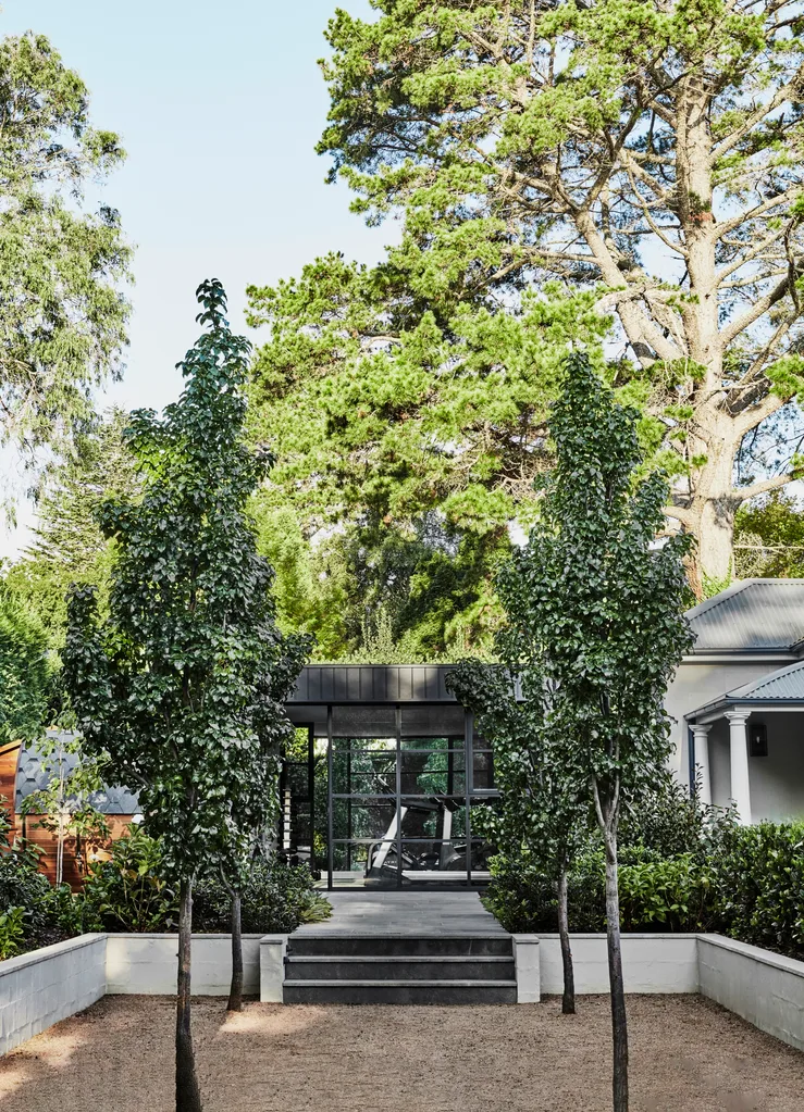 A garden path leading to a gym pavilion.