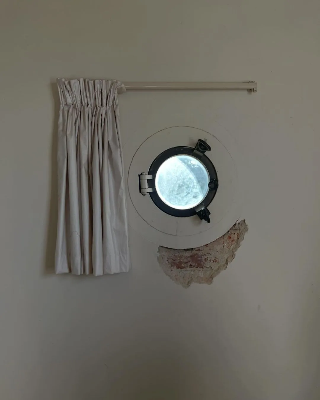 Porthole in Andy Lee and Rebecca Harding's renovation. 