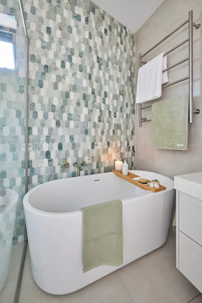 Jesse and Paige bathroom with fish scale tiles behind bath