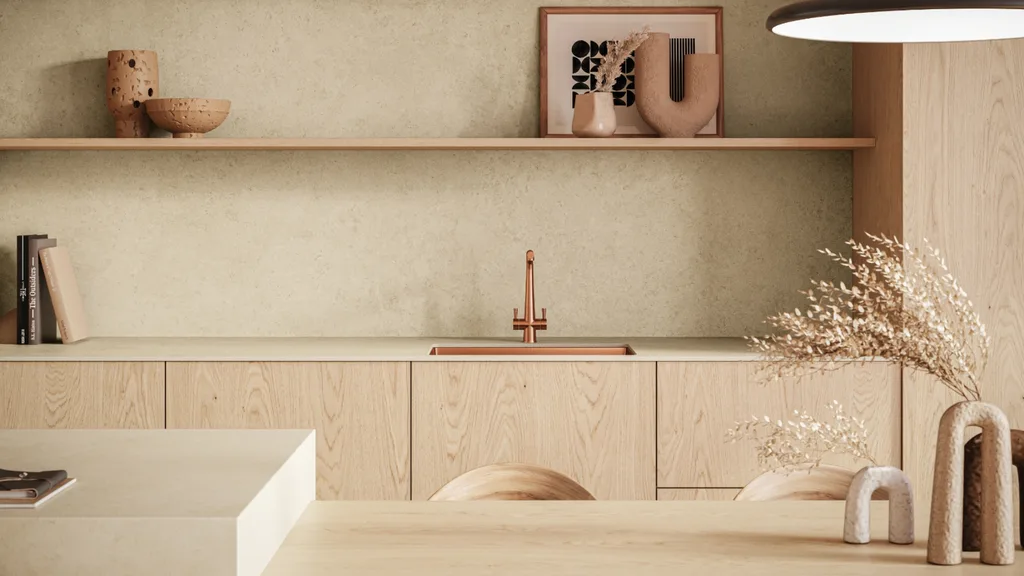 A beige, oat kitchen with touches of brass and rose gold decor
