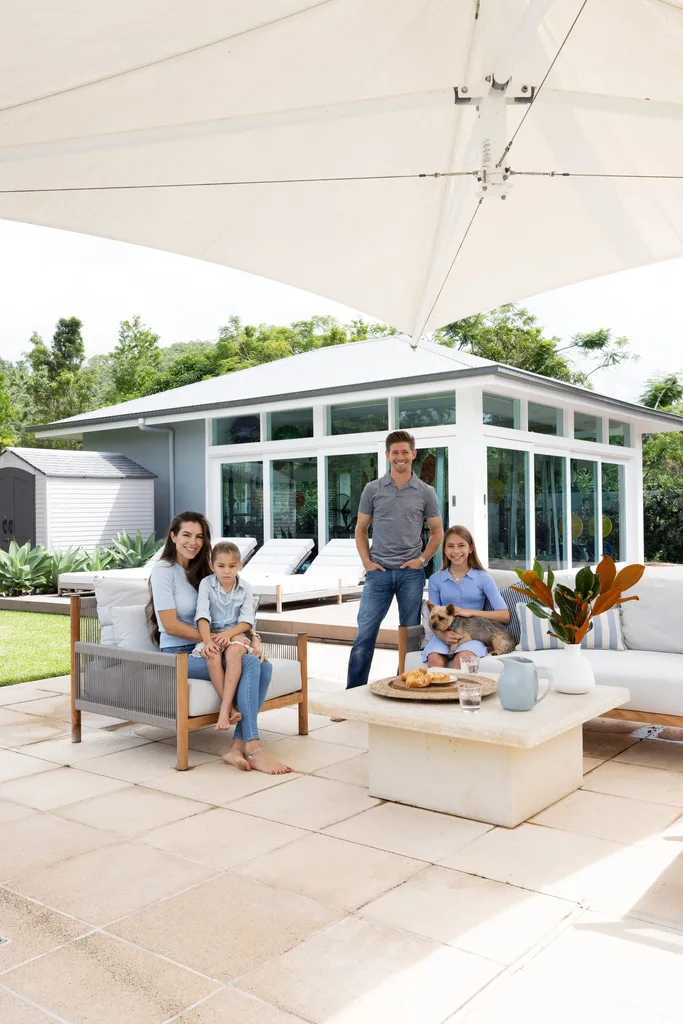 Adriana and Casey Stoner and their family in the outdoor seating area.