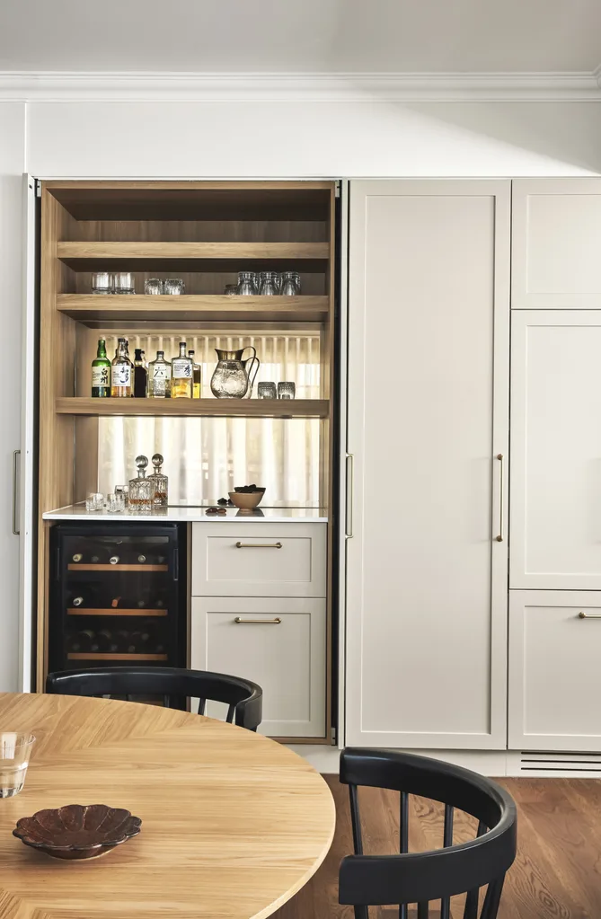 Shaker-style kitchen cabinets with an inset bar area.