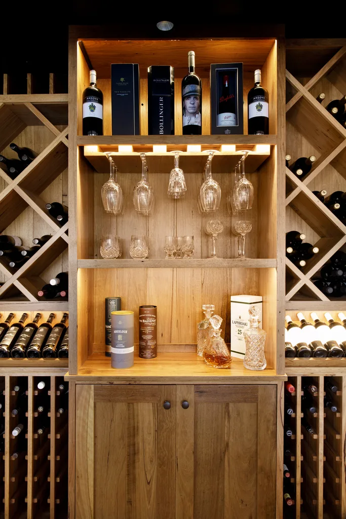 A timber wine cabinet with a bar area.