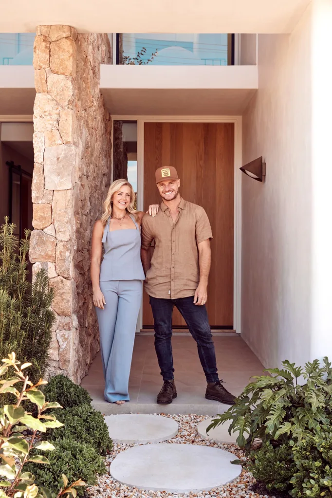 Kyal and Kara at the home's stone front entrance.
