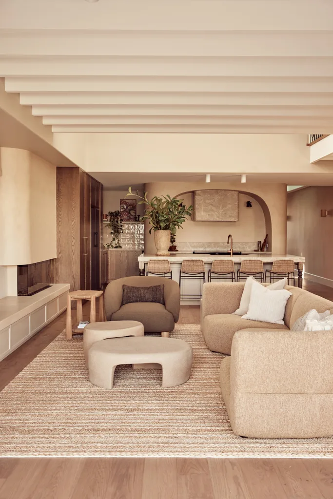 An open-plan living and kitchen area with neutral furnishings.