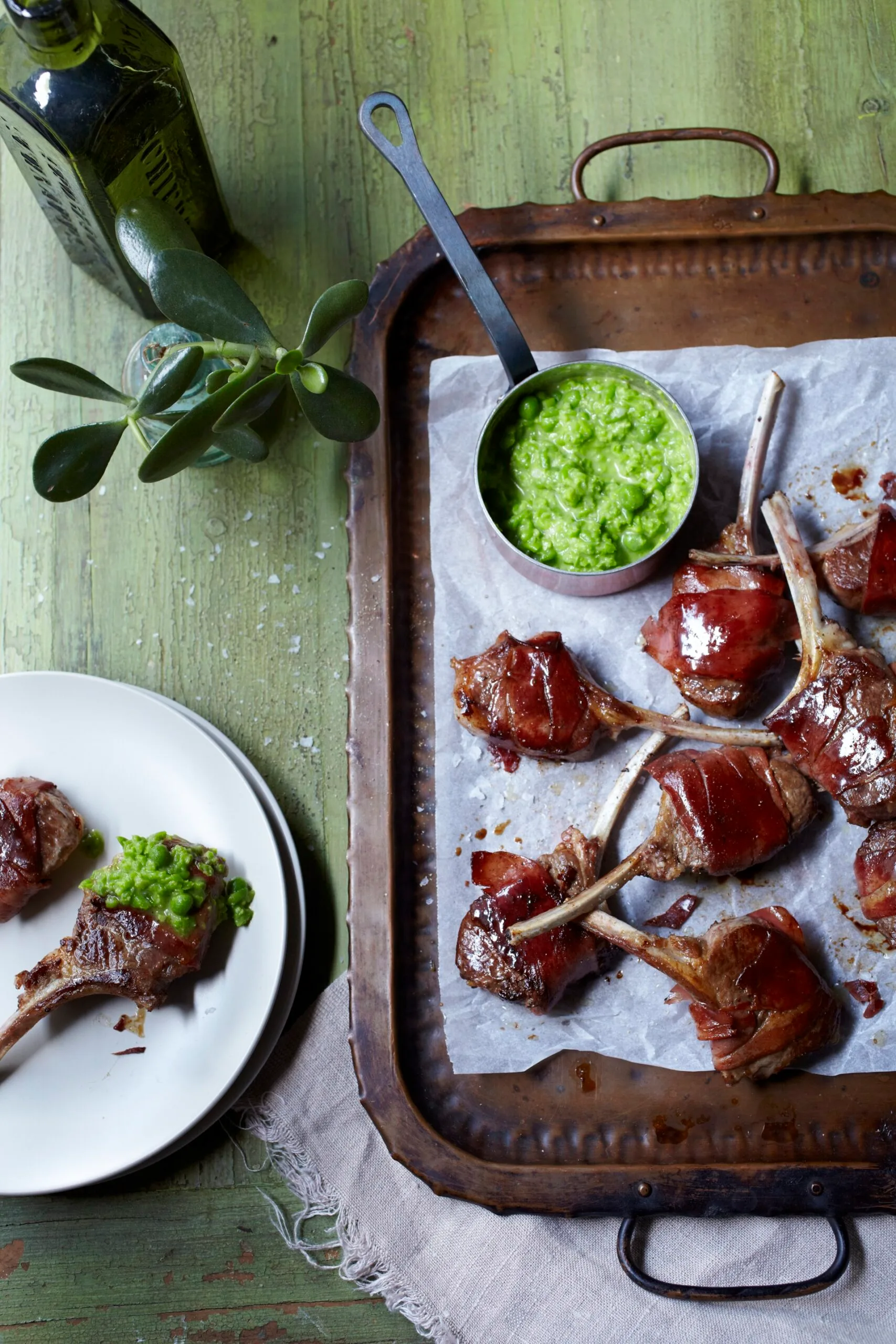 Lamb cutlets with pea puree on a tray