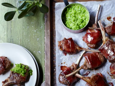 Lamb cutlets with pea puree on a tray