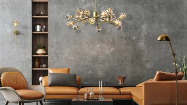 Orange leather sofa with bright chandelier