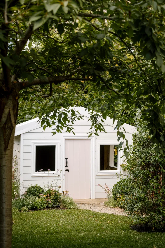 A cubby house and garden designed by Ashley James.