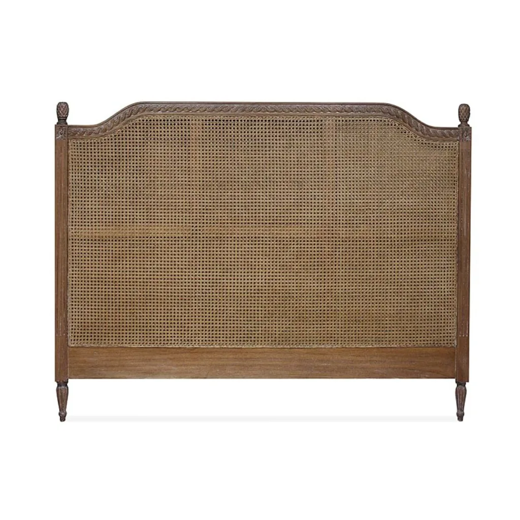 A dark rattan bedhead