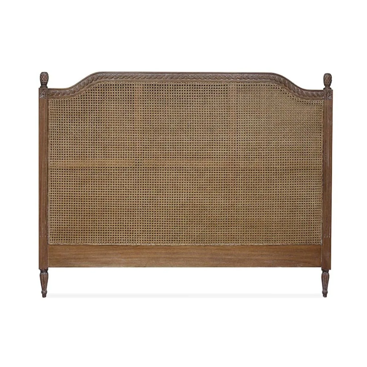A dark rattan bedhead