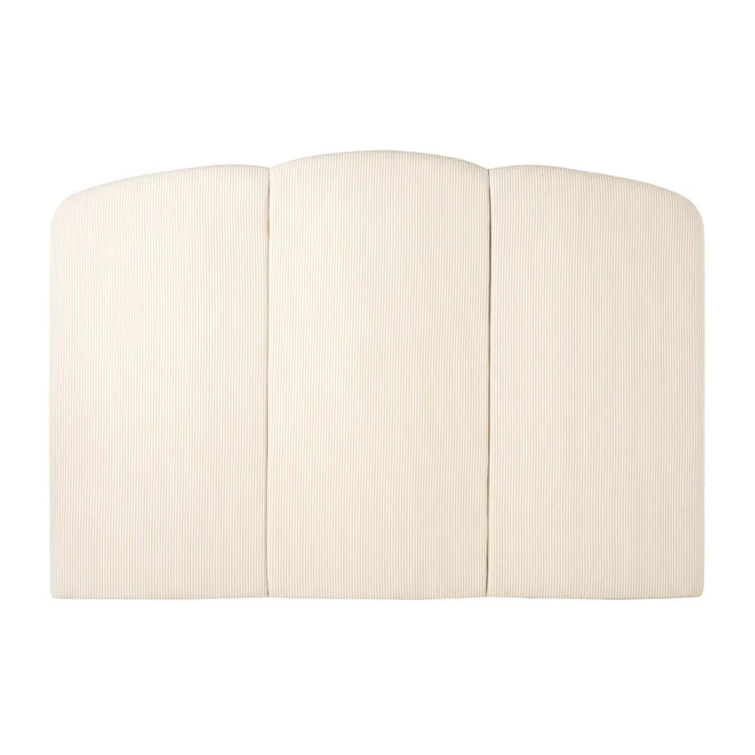 A striped upholstered bedhead. 
