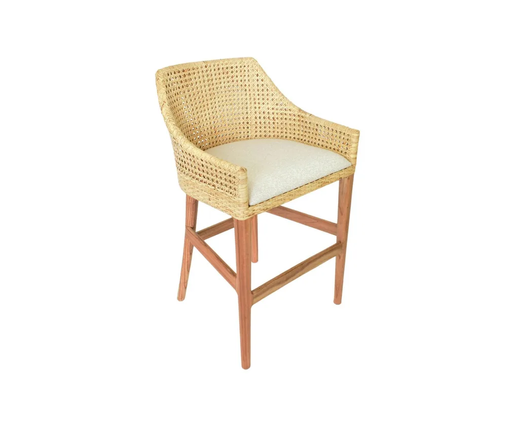 A light rattan bar stool with a high back.