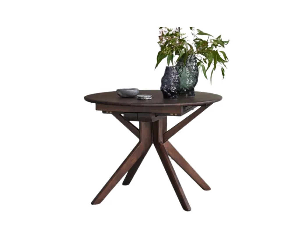 A small round extendable dining table. 