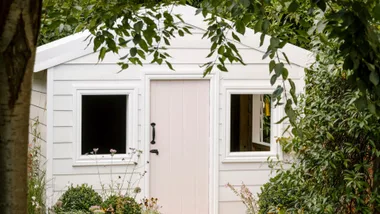 A cubby house and garden designed by Ashley James.