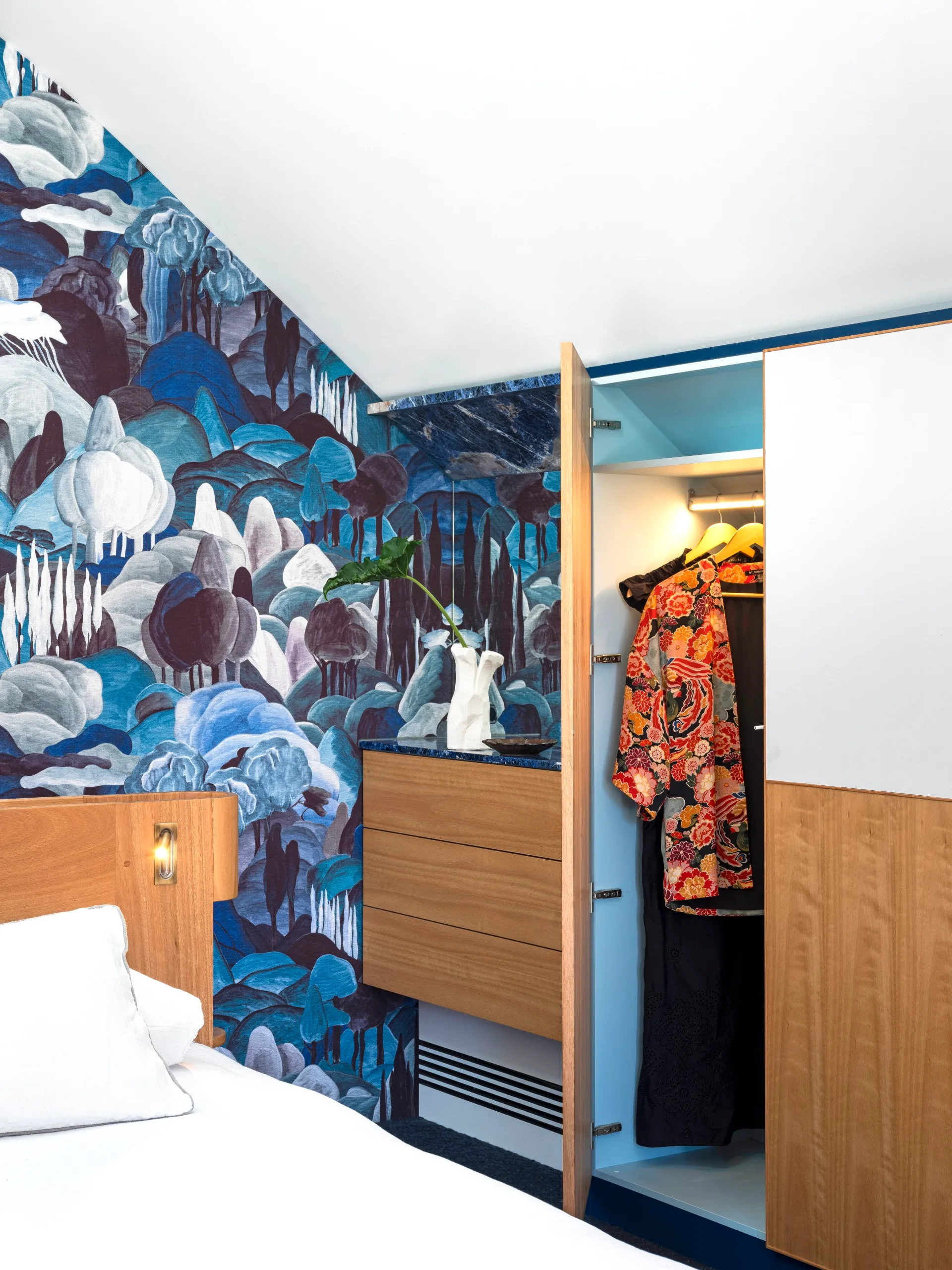 Blue patterned wallpaper in the bedroom. 