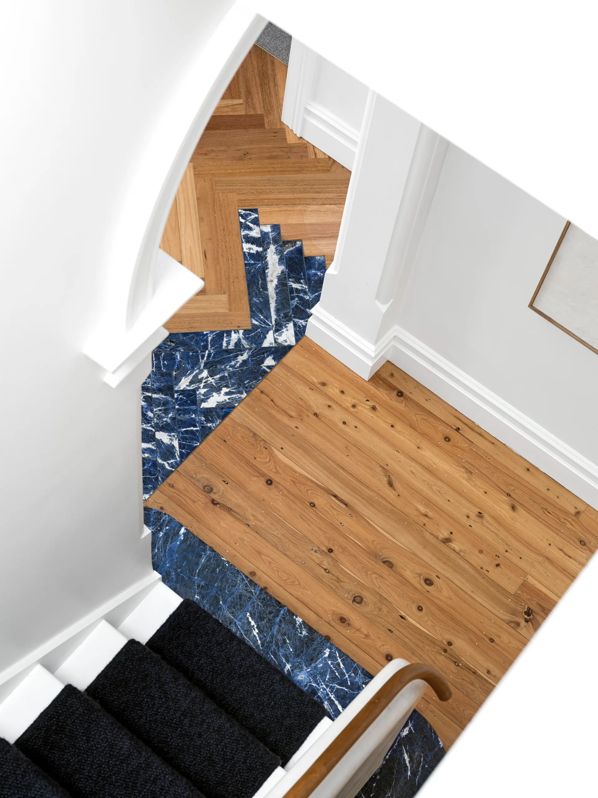 Blue tiles under the staircase. 