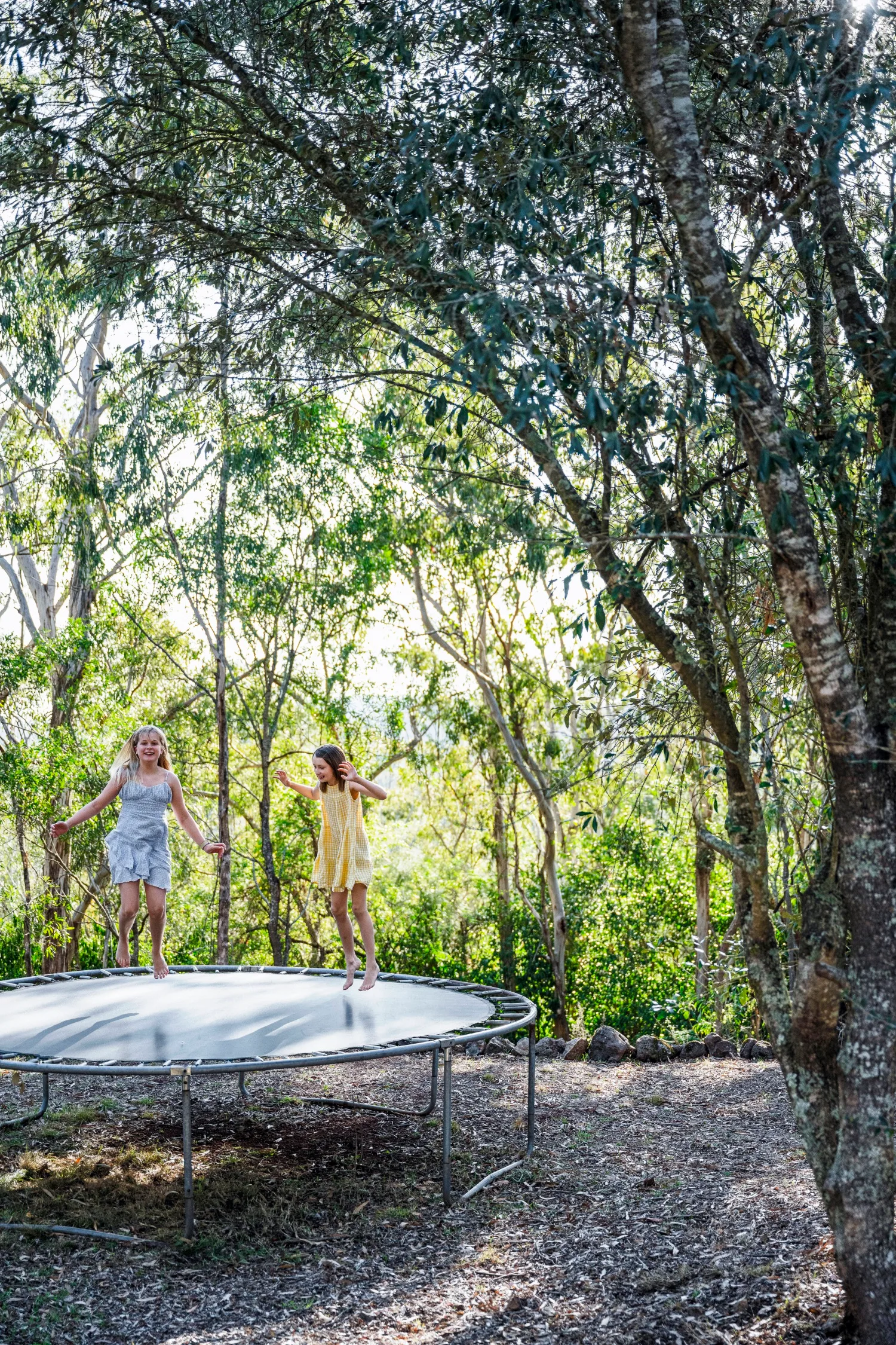 Ivy And Piper Designer's Toowoomba 1940s Queenslander with Trampoline surrounded by trees