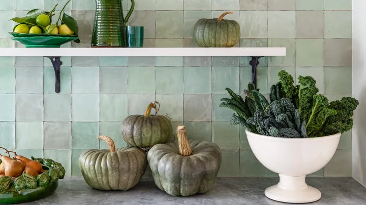 Country details in a green kitchen.