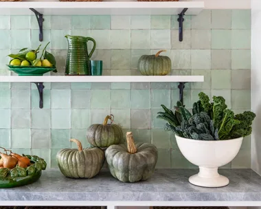 Country details in a green kitchen.
