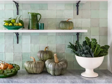 Country details in a green kitchen.