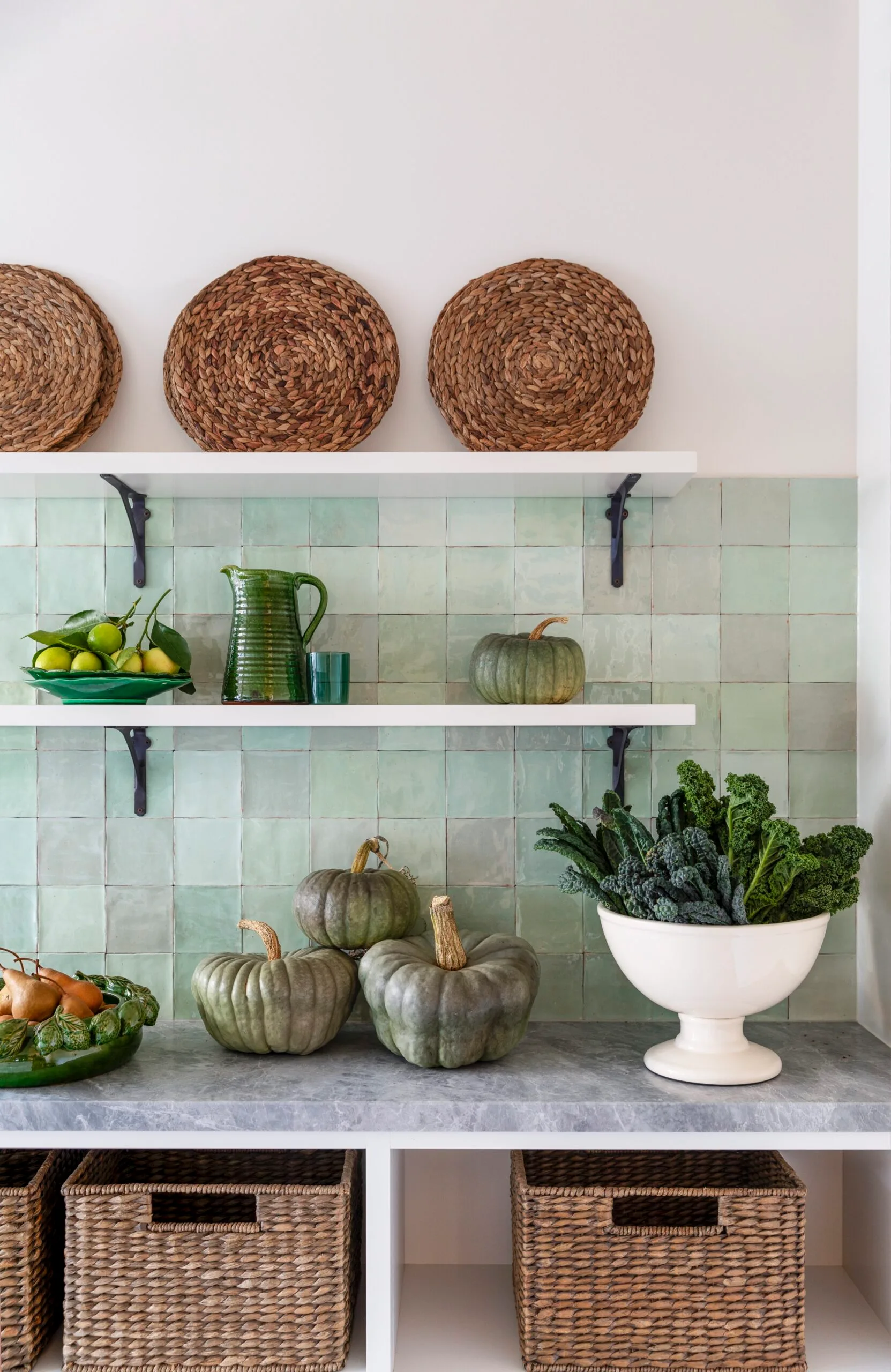 Country details in a green kitchen. 