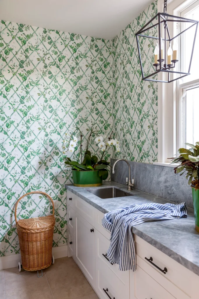 A laundry with wallpaper in South Yarra.