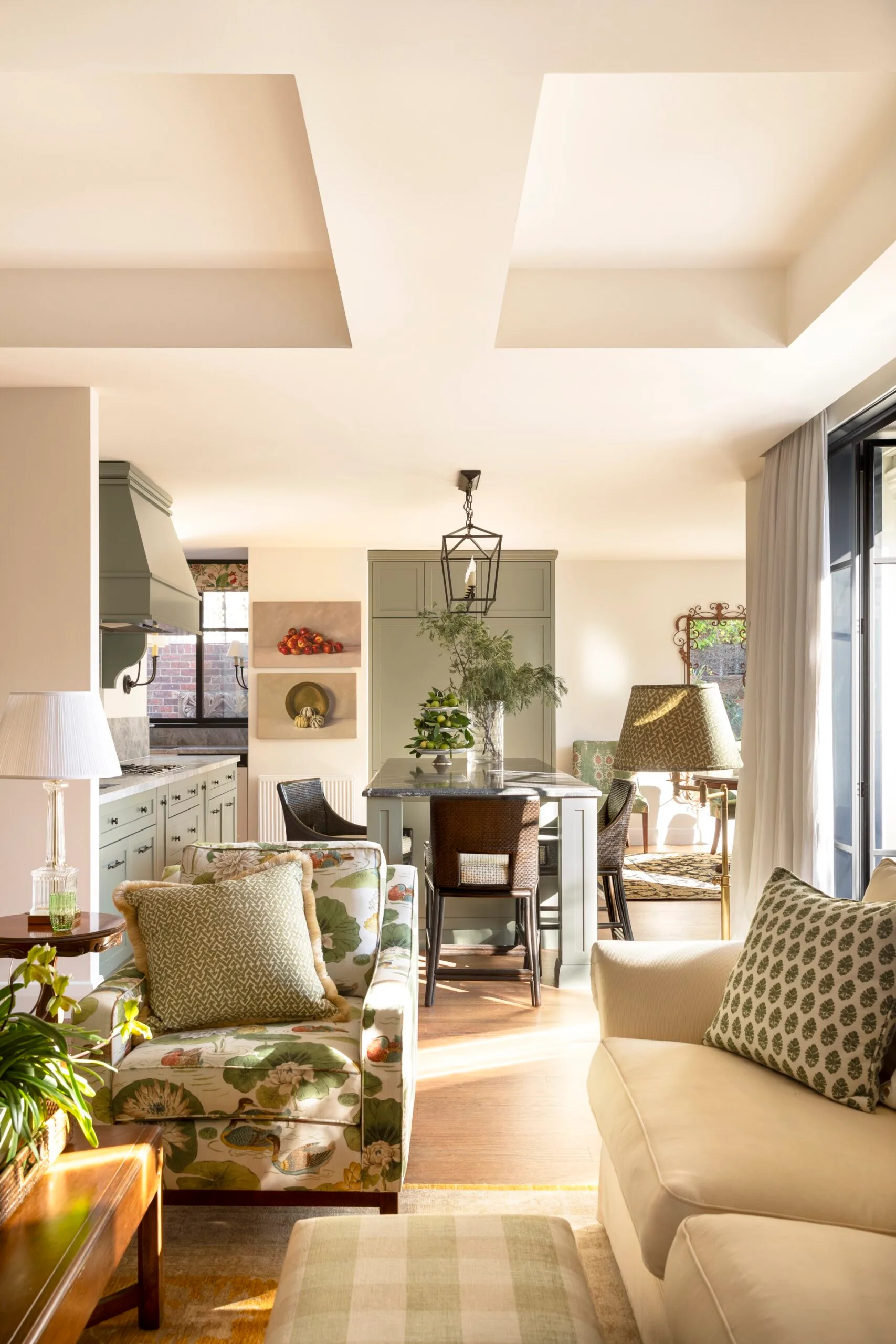 A sunny kitchen and living area. 