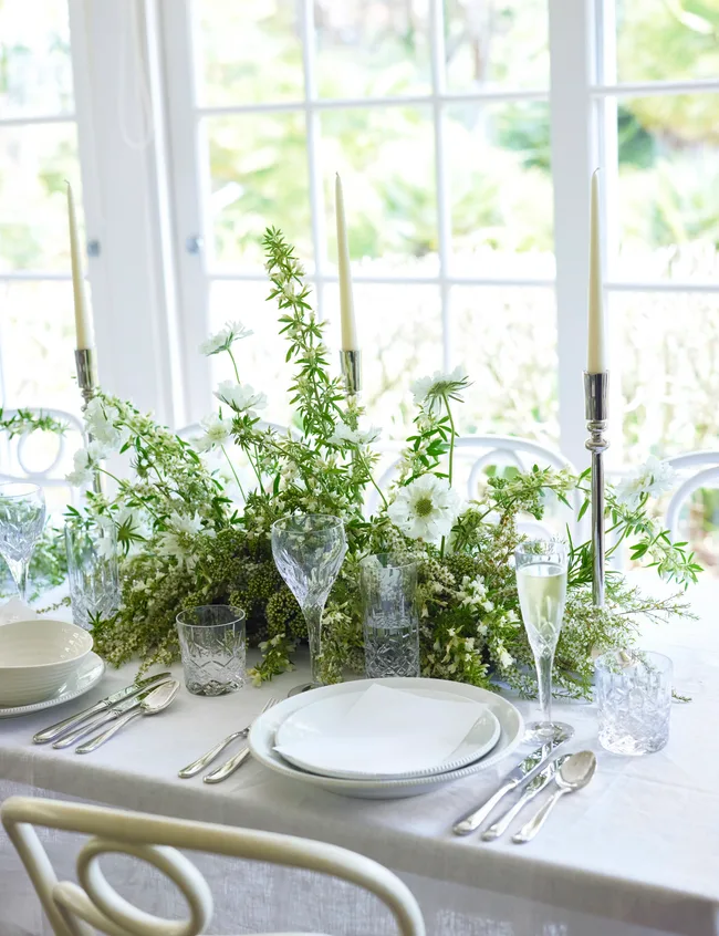 White table with greenery