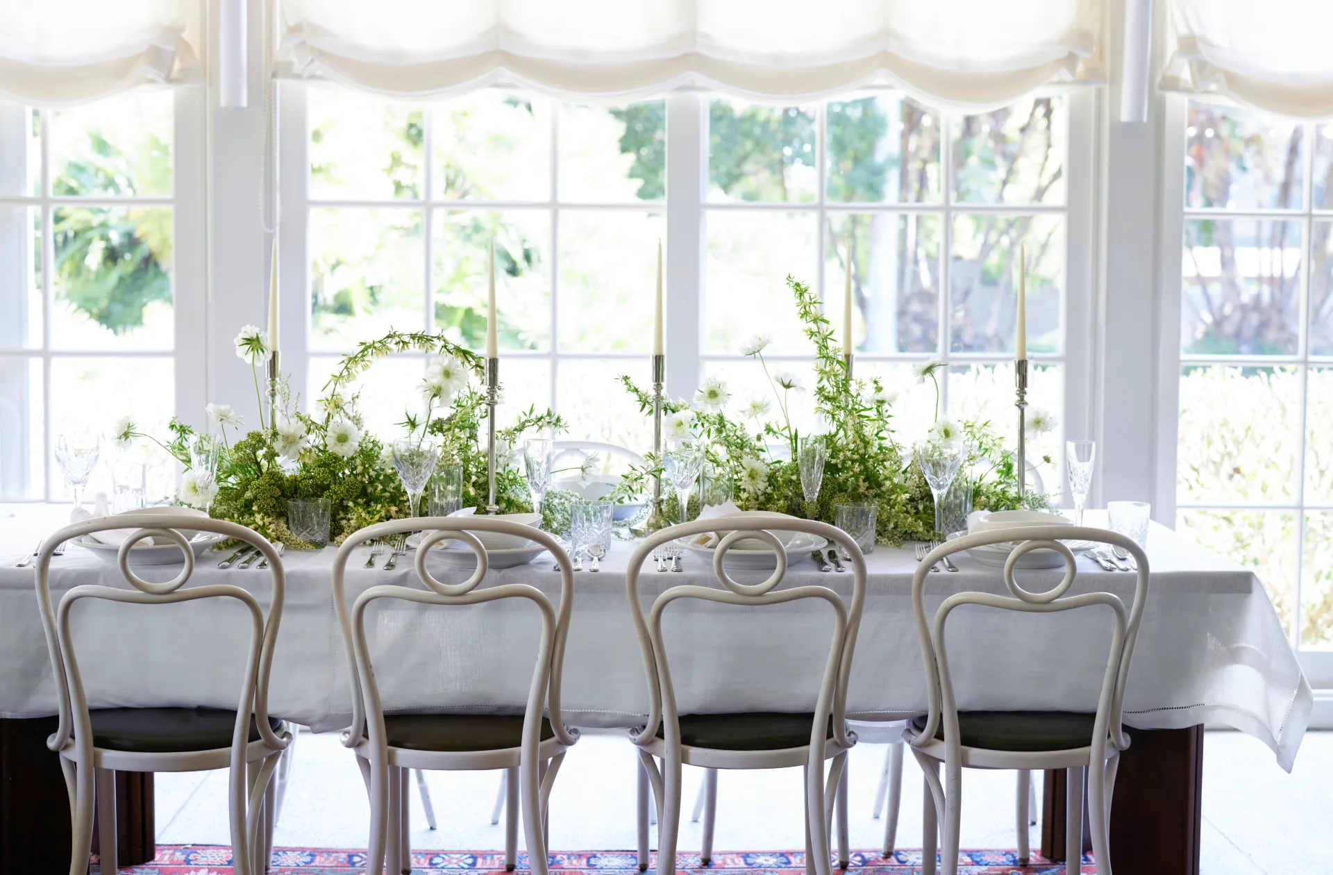 A white table with greenery in Chiswick restaurant
