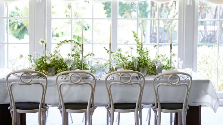 A white table with greenery in Chiswick restaurant