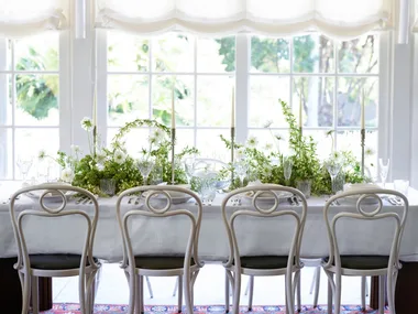 A white table with greenery in Chiswick restaurant