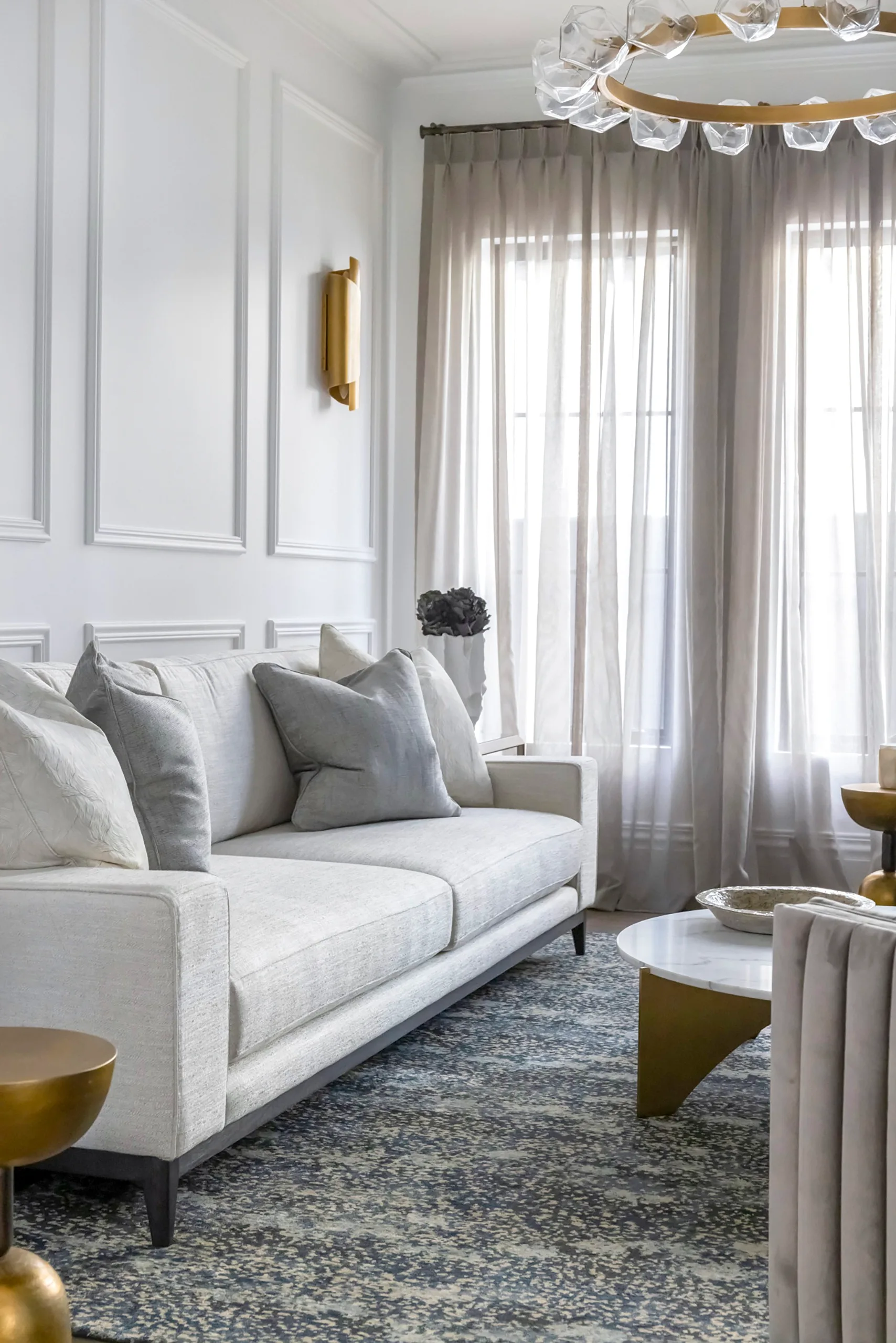 Coco Republic Interior Design Masterclass living room with sofa, wall moulding detail and sheer curtains