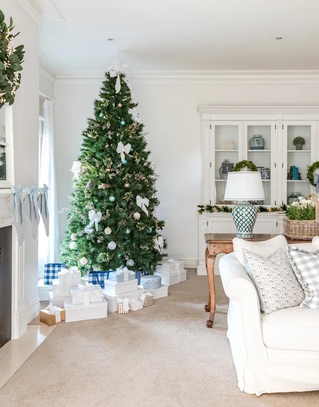 This family Christmas tree is inspired by Hamptons style, with a palette of light blue, navy and white.