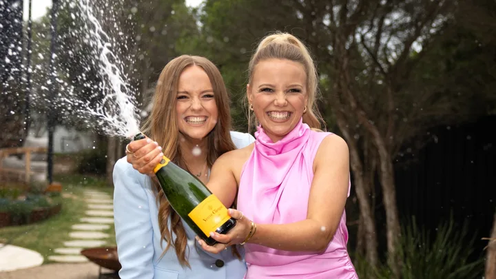 The Block 2024 winners Maddy and Charlotte Popping Champagne
