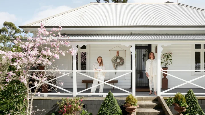 The exterior of the white cottage owned by Austin Bloom florists.